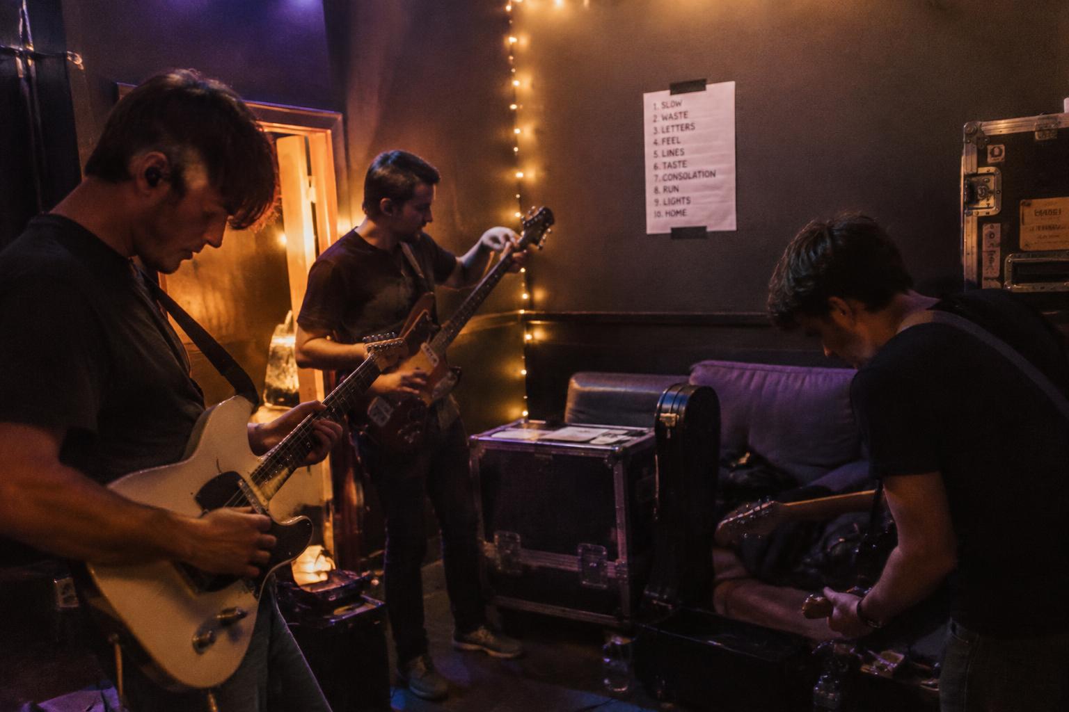 A band tuning up backstage